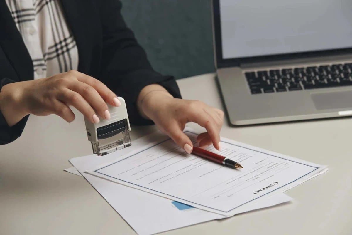 Notary stamping a signed contract